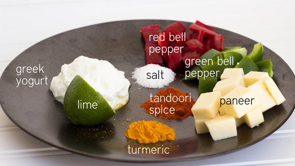 A step by step guide to making Paneer Tikka Masala recipe, a gorgeous Indian dish made with thick paneer cheese, yogurt, peppers and colorful spices.
